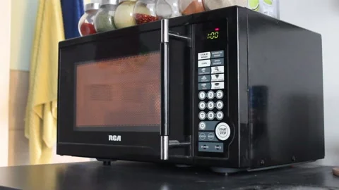 Heating Up A Drink In A Microwave Stock Footage 237722489
