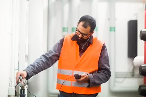 Heating engineer checking system Stock Photos