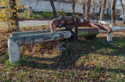 Heating in the fall of rusty pipes Stock Photos