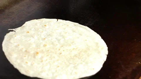 Heating Flour Tortilla Stock Footage 7899778