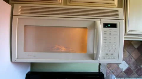 Heating food in Microwave Stock Footage 10931454