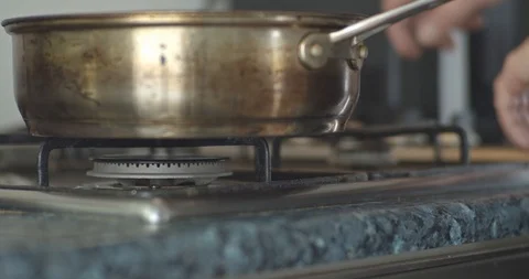 Heating up the frying pan on the stove Stock Footage 117472153