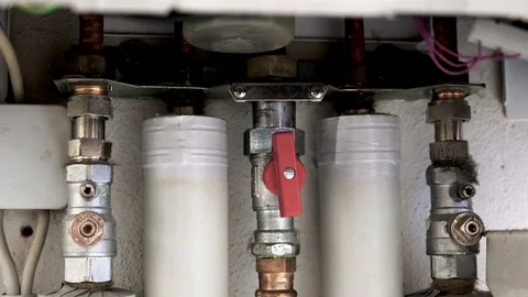 Heating installation under a water boiler with copper piping Stock Footage 121531262