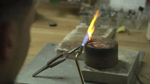 Heating a jewellry ring until its red hot Stock Footage 253303649