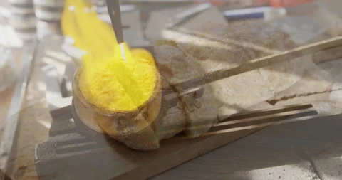 Heating metal with torch flame over rustic bread on wooden cutting board Video stock 305117572