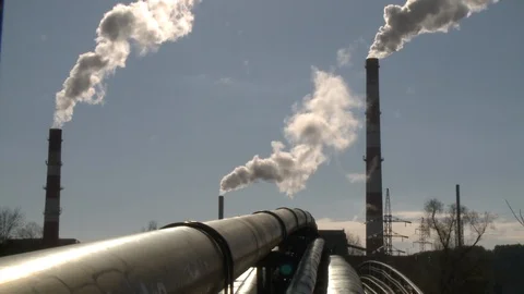 Heating network pipes and smoke rising from big chimney on blue sky. Static shot Stock Footage 117045908