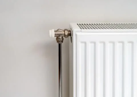 Heating panel convector radiator and heater manual valve. Stock Photos