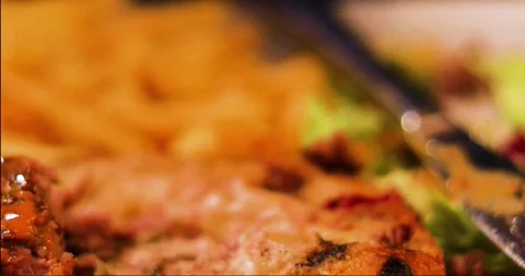 Heating a piece of hot beef steak with a fork Stock Footage 307302001