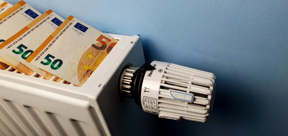 A heating radiator battery with a temperature controller from which 50 euro Stock Photos