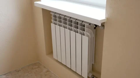 Heating radiator mounted at wall niche in new built room. Stock Footage 285942321