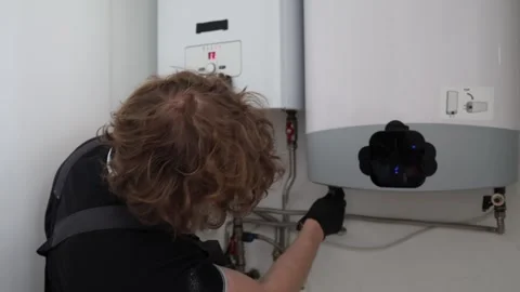 Heating season boiler maintenance Stock Footage 335045682