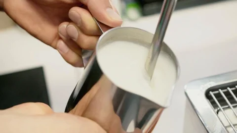 Heating up some milk for coffee Video stock 106329570