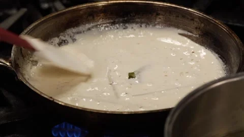Heating soup Stock Footage 307339969
