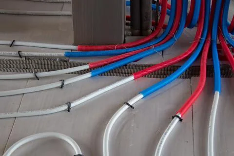 Heating system and underfloor heating made of metal-plastic in insulation. Stock Photos