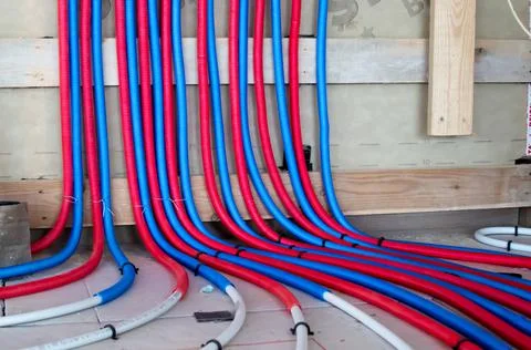 Heating system and underfloor heating from metal-plastic pipes. Central heating. Stock Photos