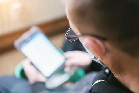 Heating system engineer ist adjusting the digital w-lan network thermometer r Stock Photos