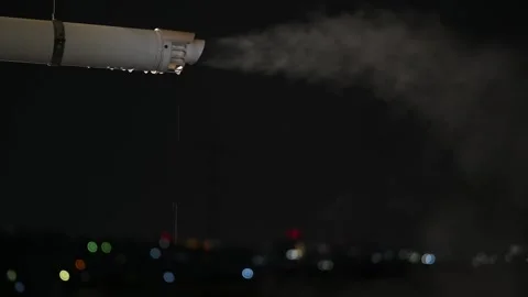 Heating System Vapor Emission at Night with city lights in the background Stock Footage 328330923