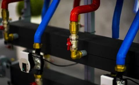 Heating system's cooper pipes with ball valves Stock Photos