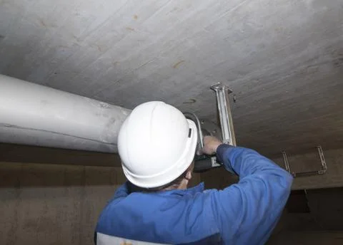 Heating technician during repairs in a building Stock Photos