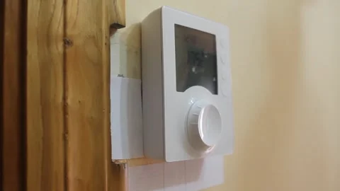 Heating thermostat left side view Stock Footage 322026854