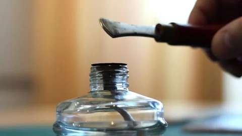 Heating the tool for working with the leather on the fire of an alcohol lamp Stock Footage 150477614