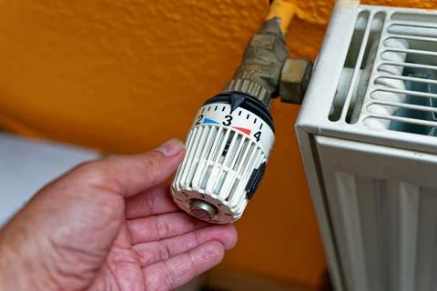 Heating valve with the hand Stock Photos
