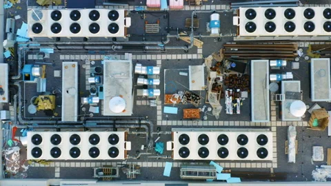 Heating, ventilation and air conditioning systems installed on a rooftop. Aerial Stock Footage 158586032