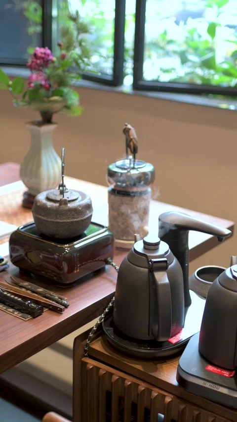 Heating Water And Brewing Tea With Modern Teapots On Display Stock Footage 326031353