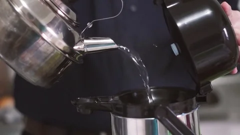 Heating the water for a good chimarrao - dumping water into the thermos Stock Footage 79682164