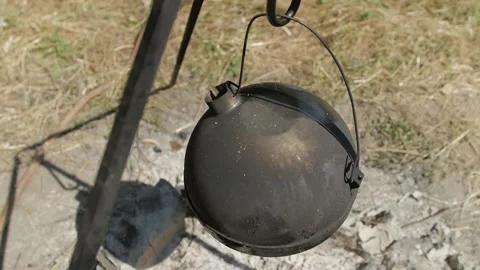 Heating water in a kettle on a fire during a hike 스톡 동영상 144682006