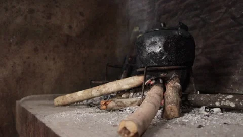 Heating Up Water Over An Open Fire Outdoor On A Early Morning In A Village In Stock Footage 157477458