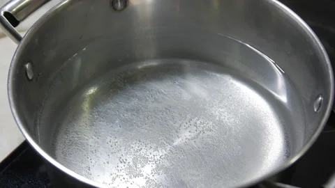 Heating Water In Saucepan Stock Footage 144421380