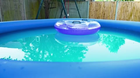 Heatwave backyard pool cooling. Home inflatable swimming pool helping during Stockbeeldmateriaal 337879482