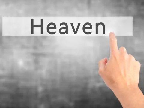 Heaven - Hand pressing a button on blurred background concept on visual scree Stock Photos