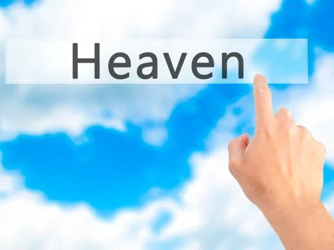 Heaven - Hand pressing a button on blurred background concept on visual scree Stock Photos