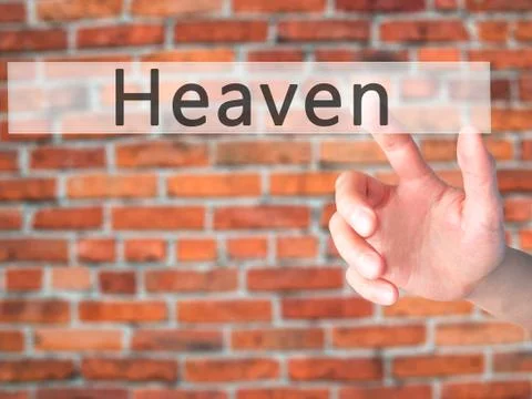 Heaven - Hand pressing a button on blurred background concept on visual scree Stock Photos