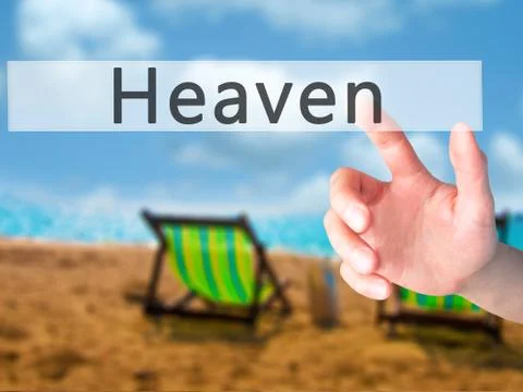 Heaven - Hand pressing a button on blurred background concept on visual scree Stock Photos