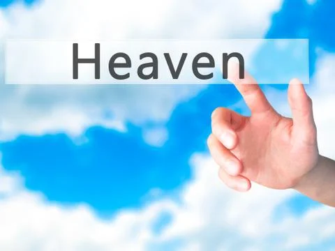 Heaven - Hand pressing a button on blurred background concept on visual scree Stock Photos