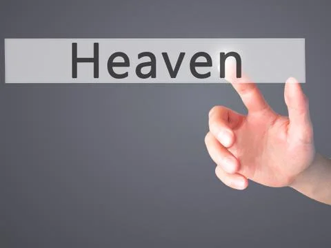 Heaven - Hand pressing a button on blurred background concept on visual scree Stock Photos