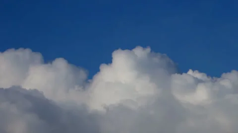 Heaven river of lumpy puffy sunny clouds on deep blue sky background. Stock Footage 39553875