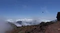 Heavenly clouds and pathway on rocky mountain peak in La Palma island with bird 4k or 4k+ Resolution