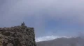 Heavenly clouds and thick fog on rocky mountain peak in La Palma island 4k or 4k+ Resolution