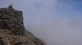 Heavenly clouds and thick fog on rocky mountain peak in La Palma island 4k or 4k+ Resolution