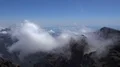 Heavenly clouds and thick fog on rocky mountain peak in La Palma island 4k or 4k+ Resolution
