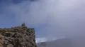 Heavenly clouds and thick fog on rocky mountain peak in La Palma island Photo