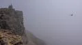 Heavenly clouds and thick fog on rocky mountain peak in La Palma island Photo