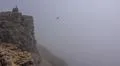Heavenly clouds and thick fog on rocky mountain peak in La Palma island Photo