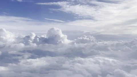Heavenly clouds from a plane window in flight 4k 30fps Stock Footage 240357885