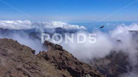 Heavenly clouds on rocky mountain peak in La Palma island Stock Photos