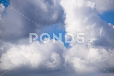 Heavenly landscape with clouds. Cumulus clouds in the sky Stock Photos